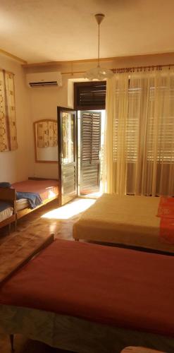 Postel nebo postele na pokoji v ubytování Apartmani Vesna