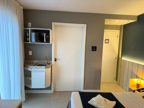 Postel nebo postele na pokoji v ubytování Flat 218 completo com localização privilegiada