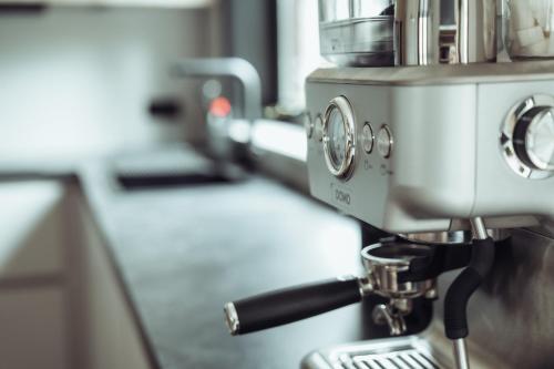 a mixer sitting on top of a kitchen counter at Arrivée - 5-Star Luxury Sports-Inspired Holiday House in Merelbeke