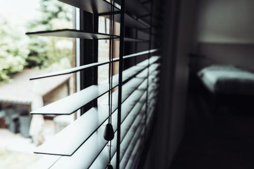 a window sill with a view of a balcony at Arrivée - 5-Star Luxury Sports-Inspired Holiday House in Merelbeke