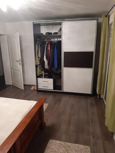 a bedroom with a closet with a large mirror at MEDINA in Sarajevo