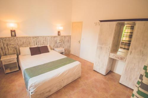 Ein Bett oder Betten in einem Zimmer der Unterkunft Andy Villa