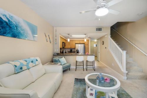 a living room with a couch and a table at Hillside Villas 1498-3 in Kapolei