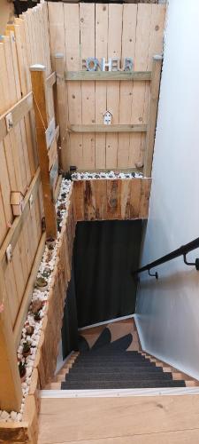 a set of stairs in a building with at Le pat' toit in Aurec-sur-Loire