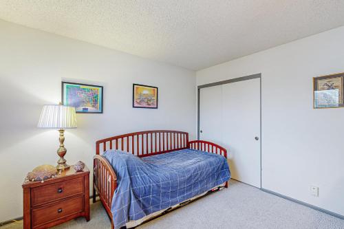 a bedroom with a bed and a dresser and a lamp at Gateshead Haven in Oxnard