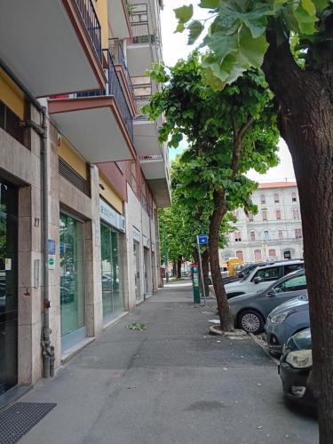 a street with cars parked next to a building at KeyRooms in La Spezia