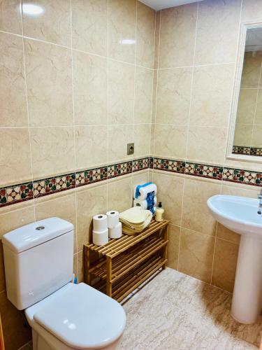 a bathroom with a toilet and a sink at Apartamento Perla Playa in Mojácar
