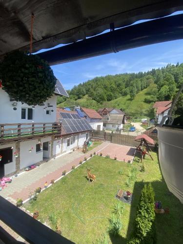 a view of a yard from a window of a building at Casa Cipri si Alex in Şimon