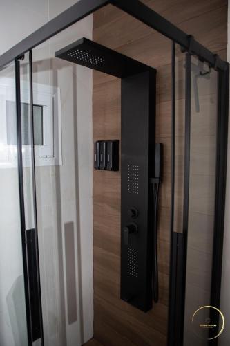 a glass door in a room with wooden floors at Sunset Shores Mola Kaliva in Mola Kalyva