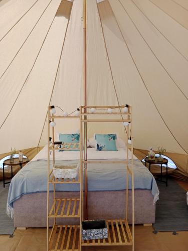 a bedroom with a bed in a tent at Czyli Chill in Nisko