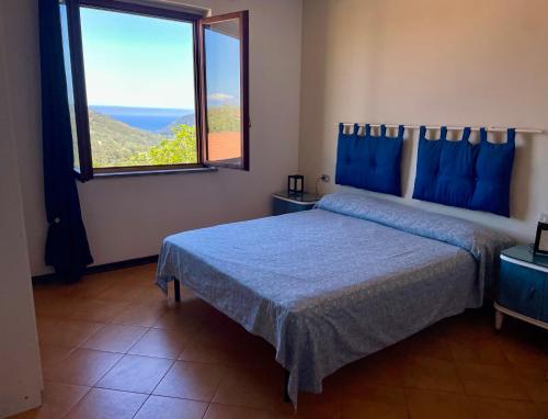Ένα ή περισσότερα κρεβάτια σε δωμάτιο στο Blu Elba