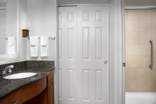 A bathroom at Homewood Suites by Hilton Omaha - Downtown