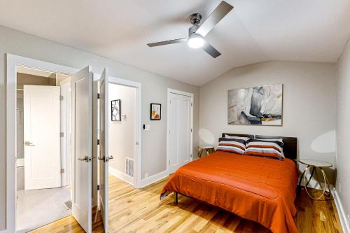 a bedroom with a bed and a ceiling fan at Blossoming Beauty in Decatur