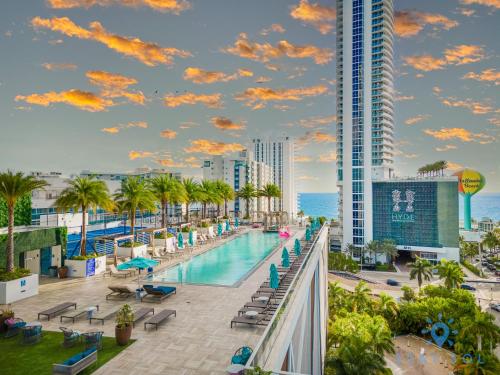 a view of the pool at a resort with a building at Beach House Design in Hollywood