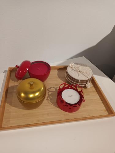 a wooden tray with various items on a table at Seaview studio in Neapolis