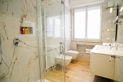 a bathroom with a shower and a toilet and a sink at Bergamini 23 Lake Garda in Peschiera del Garda