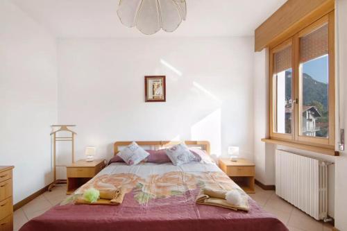 Ένα ή περισσότερα κρεβάτια σε δωμάτιο στο Casa Suono del Sole
