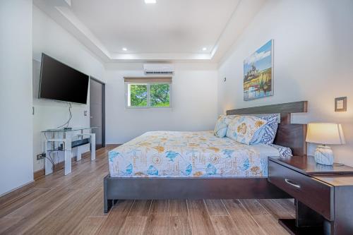 Ein Bett oder Betten in einem Zimmer der Unterkunft Jacarandas 4