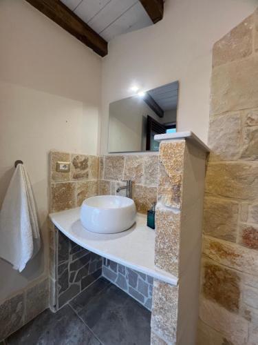 a bathroom with a sink and a mirror at Villa Assuntina in Cellino San Marco