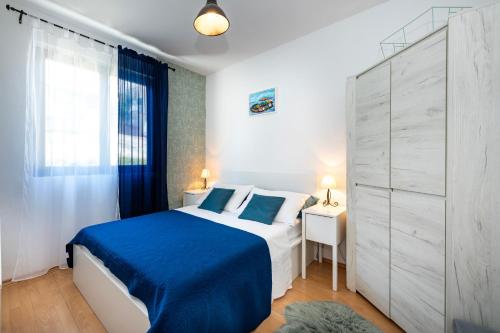Ένα ή περισσότερα κρεβάτια σε δωμάτιο στο Apartments Bellezza
