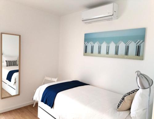 En eller flere senge i et værelse på Porto Santo - Pedras Pretas Beach House