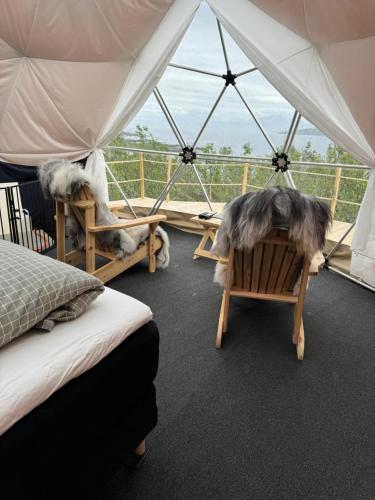 a room with two beds and a tent at Northern Light Panorama Evenes 