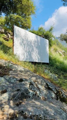 a blank screen sitting on the side of a hill at Paradise Ranch Inn- Limitless House Hot Tub,Sauna in Three Rivers