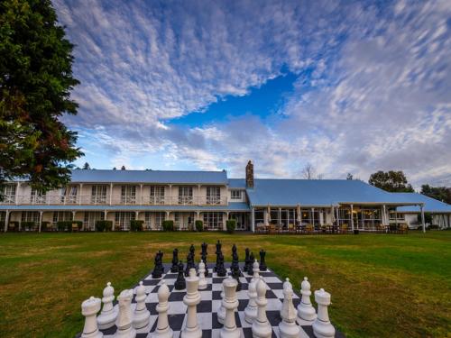 a large chess board in front of a building at VR Rotorua Lake Resort in Rotorua