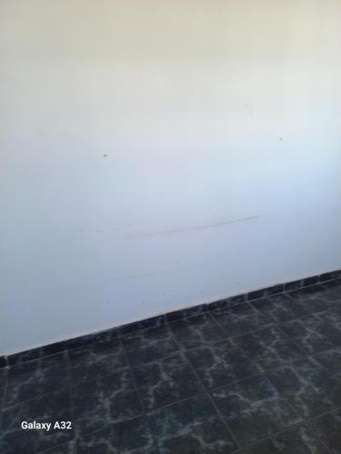 a wall of a building with a tile floor at Mansão Espetacular , vista para lagoa in São Pedro da Aldeia