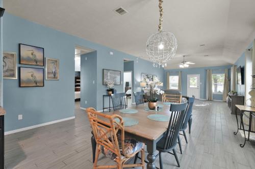 a dining room and living room with a table and chairs at Peace, serenity and relaxation on the lake in Conroe