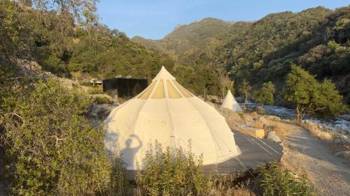 a large tent in the middle of a river at Paradise Ranch Inn - Abundance Tent in Three Rivers