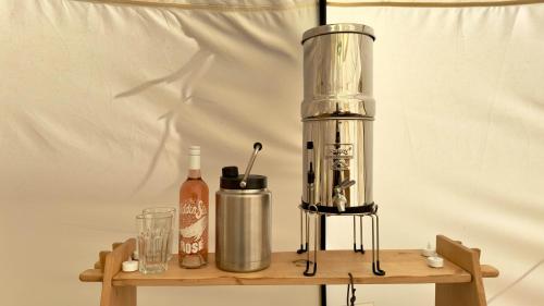 a blender sitting on top of a wooden shelf at Paradise Ranch Inn - Lucky Tent in Three Rivers