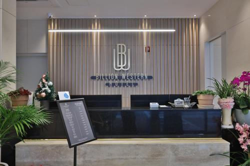 a lobby of a hotel with a reception desk at Daegu Billion Western Hotel in Daegu