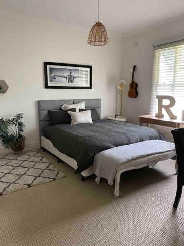 a bedroom with a large bed in a room at Prouts lodge in Eden Park