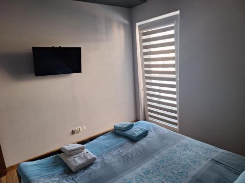 Postel nebo postele na pokoji v ubytování Apartament kwiatowa