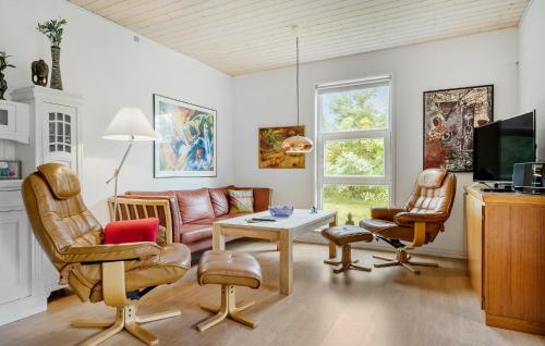 a living room with a couch and chairs at 3 Bedroom Nice Home In Skjern in Skjern