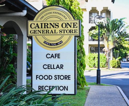 a sign for a cafe cellar food store at Tropical Gardens - Resort 9 Pools free parking in Cairns