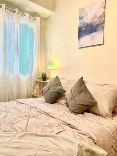 Ένα ή περισσότερα κρεβάτια σε δωμάτιο στο The Comfort Zen