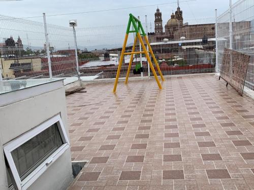 a playground on the roof of a building at Casa céntrica en Morelia. in Morelia