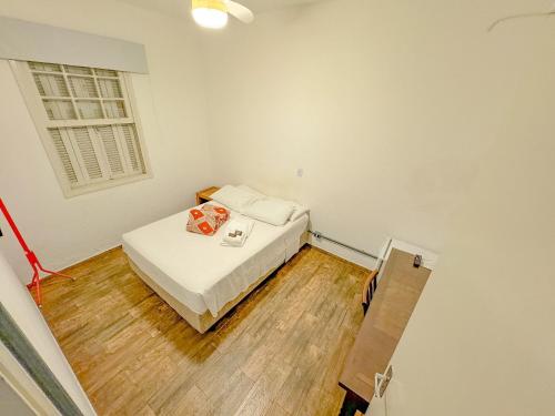 Postel nebo postele na pokoji v ubytování Edificio Barros - Suítes Exclusivas
