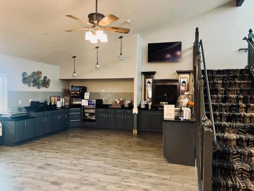 a large room with a counter in a store at AmericInn by Wyndham Beaver Dam in Beaver Dam
