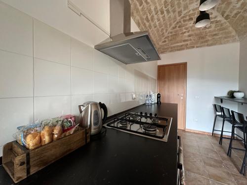 a kitchen with a stove and a counter top at RADICl BUSSI in Bussi sul Tirino