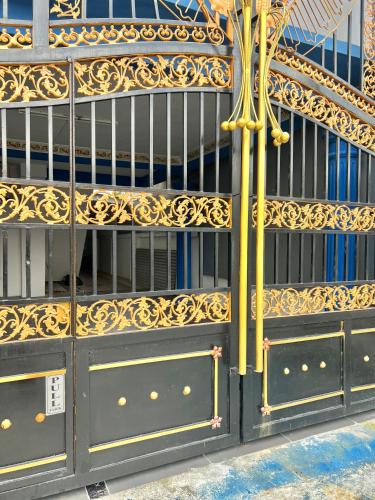 a set of metal shelves with gold designs on them at DP Residence SELAYANG in Batu Caves