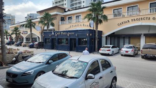 a couple of cars parked in front of a building at Nice Flat in Caesar in Iskele