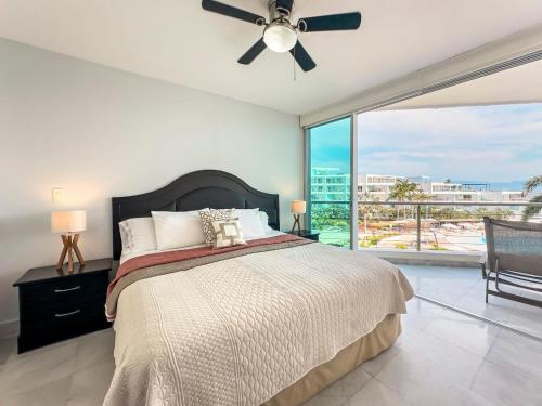 Ένα ή περισσότερα κρεβάτια σε δωμάτιο στο ARIA Residence Beachfront luxury New vallarta