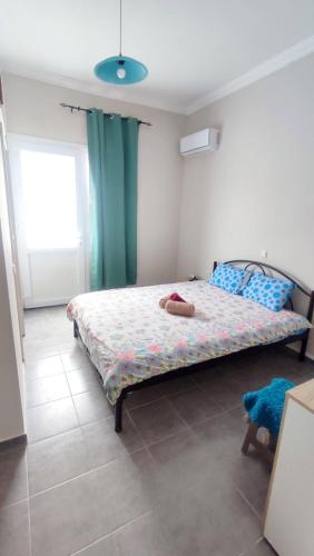 Ein Bett oder Betten in einem Zimmer der Unterkunft Iordanis