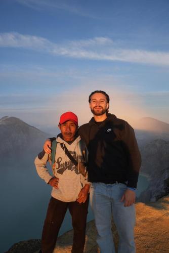 two men standing on the top of a mountain at Green ijen homestay and tour in Banyuwangi