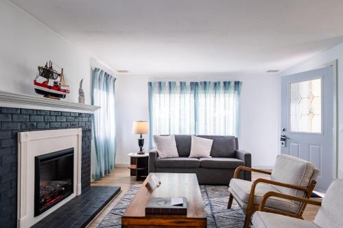 a living room with a couch and a fireplace at Inn at Haystack Rock in Cannon Beach