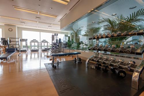 a gym with rows of chairs and a mirror at Hotel Okura Fukuoka in Fukuoka