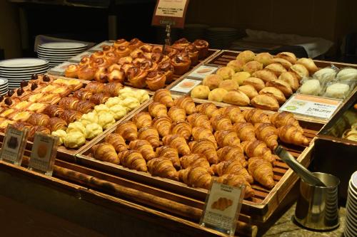 a display case filled with lots of different types of pastries at Hotel Okura Fukuoka in Fukuoka